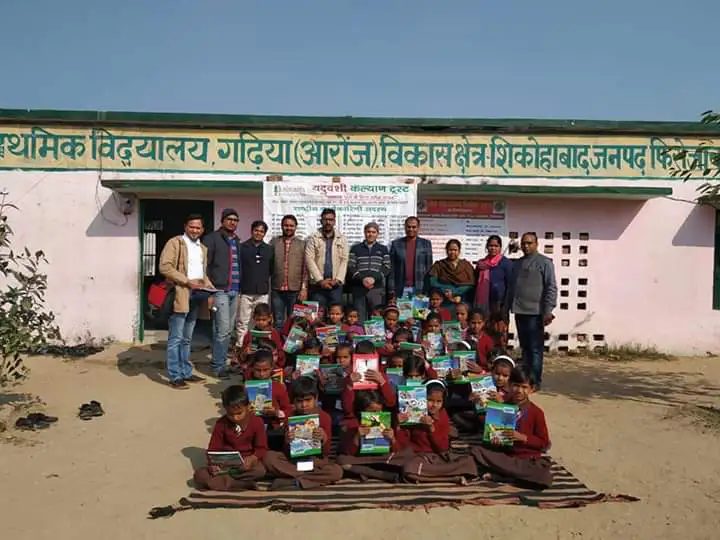 Children with new stationery outside a primary school near Shikohabad