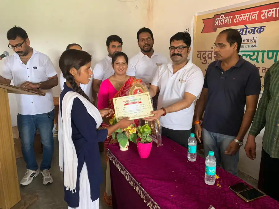 A student receives her merit certificate