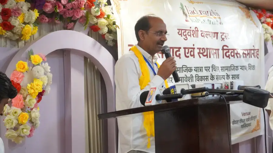 A speaker at the lectern during the Dashak Samvad