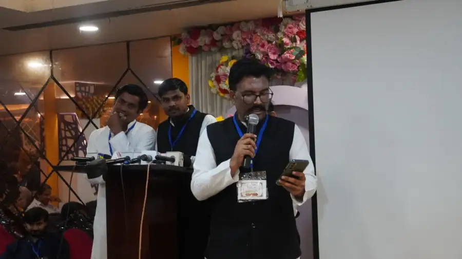 A speaker at the lectern during the talks