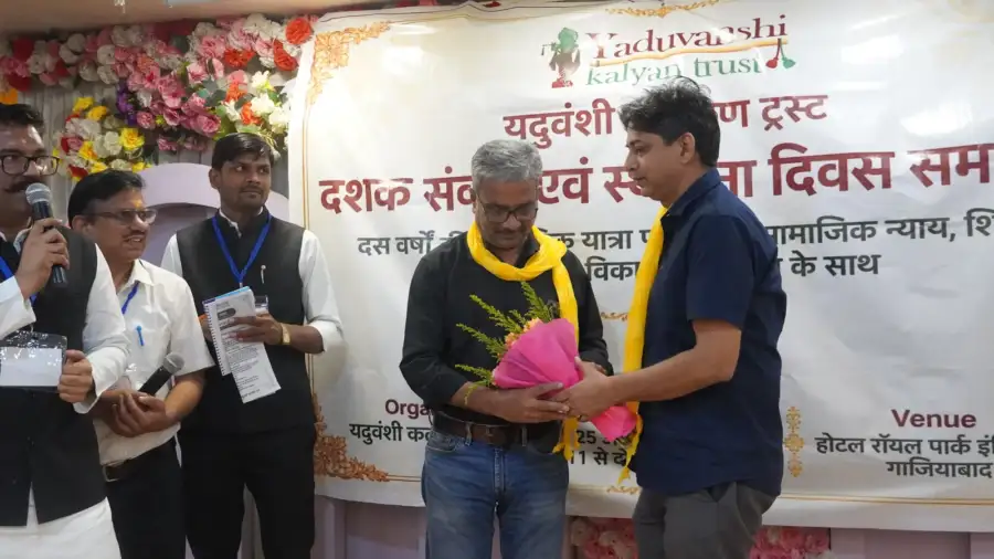 A guest receives a bouquet from the Trust